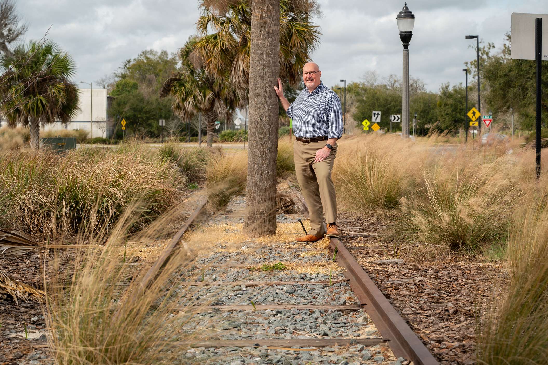 Harvey Ward standing outside on an old railroad track Harvey Ward standing outside on an old railroad track