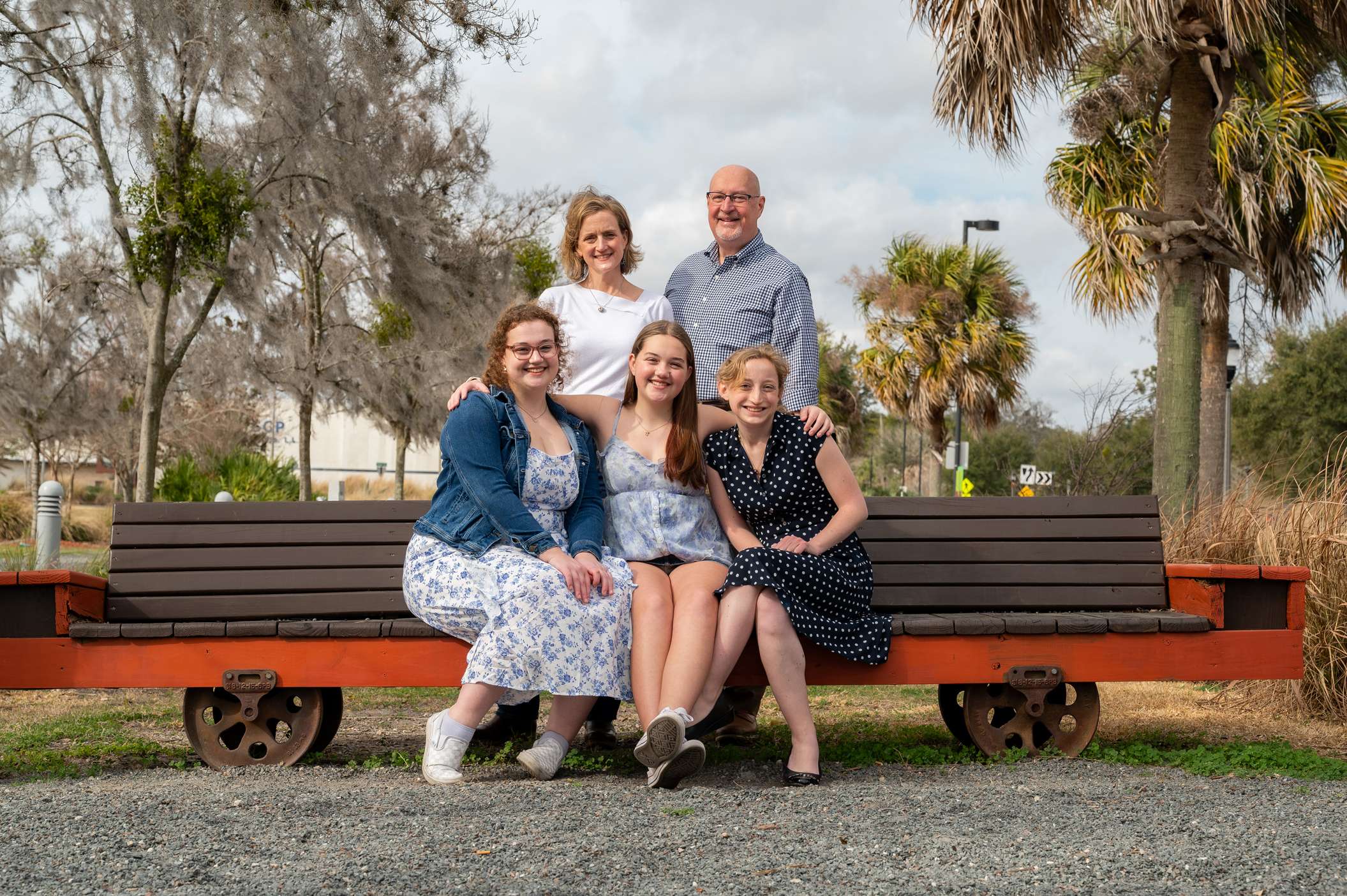 Ward family sitting together on a bench Ward family sitting together on a bench